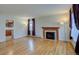 Bright living room featuring hardwood floors and a fireplace at 782 Holly St, Denver, CO 80220