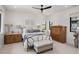 Bright bedroom with neutral decor, ample natural light, and classic furnishings at 15191 Dinosaur Ridge Rd, Morrison, CO 80465