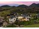 Stunning two-story home showcases elegant architecture and well-manicured landscaping at 15191 Dinosaur Ridge Rd, Morrison, CO 80465