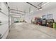 Spacious and well-lit three car garage with ample storage space and room for organization at 15191 Dinosaur Ridge Rd, Morrison, CO 80465