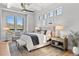 Serene main bedroom features ample natural light, a plush bed, and stylish furnishings at 15191 Dinosaur Ridge Rd, Morrison, CO 80465