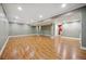 Spacious finished basement with wood floors, offering plenty of room for recreation and relaxation at 5530 E 6Th Ave Pkwy, Denver, CO 80220