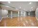 Spacious basement with new flooring and neutral colors, providing a blank canvas for customization at 5530 E 6Th Ave Pkwy, Denver, CO 80220