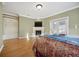 Bedroom with fireplace and built-in shelving for extra storage space at 5530 E 6Th Ave Pkwy, Denver, CO 80220