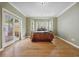 Bright bedroom with a large window seat and a sliding door to the outside at 5530 E 6Th Ave Pkwy, Denver, CO 80220