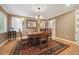 Formal dining room featuring an antique table, ornate chandelier, and classic architectural details at 5530 E 6Th Ave Pkwy, Denver, CO 80220