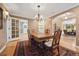 Elegant dining room with hardwood floors, chandelier lighting, and seamless flow to living spaces at 5530 E 6Th Ave Pkwy, Denver, CO 80220