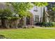 Beautiful landscaping and manicured lawn surrounding the charming Tudor-style house at 5530 E 6Th Ave Pkwy, Denver, CO 80220