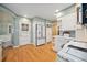 Bright kitchen featuring white cabinetry, modern appliances, and convenient breakfast nook area at 5530 E 6Th Ave Pkwy, Denver, CO 80220