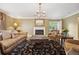 Comfortable living room featuring a fireplace, elegant rug, and ample natural light at 5530 E 6Th Ave Pkwy, Denver, CO 80220