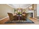 Cozy living room with hardwood floors, fireplace, decorative rug, and comfortable seating at 5530 E 6Th Ave Pkwy, Denver, CO 80220