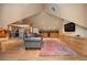 Cozy living area with wooden floors, a wet bar, and large TV, perfect for entertaining at 5530 E 6Th Ave Pkwy, Denver, CO 80220