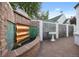 Landscaped outdoor space featuring a tranquil water feature, decorative privacy screen, and brick-paved patio at 5530 E 6Th Ave Pkwy, Denver, CO 80220