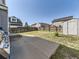 Spacious backyard features a well-maintained lawn, a wooden fence, and a convenient storage shed at 9832 Kenton Cir, Commerce City, CO 80022