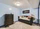 This bedroom features a modern daybed, dresser and moon-themed decor, creating a tranquil and stylish space at 9832 Kenton Cir, Commerce City, CO 80022