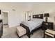 Primary bedroom with neutral walls, carpet, and an ensuite bathroom at 9832 Kenton Cir, Commerce City, CO 80022