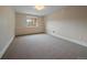 Neutral bedroom with one window bringing in natural light at 5939 Lone Peak Dr, Evergreen, CO 80439