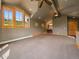 Large bonus room with multiple windows, ceiling fans, and a full bathroom at 5939 Lone Peak Dr, Evergreen, CO 80439