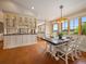 Bright dining area with views, adjacent to the kitchen at 5939 Lone Peak Dr, Evergreen, CO 80439