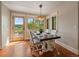 Well-lit dining area with views of the mountains at 5939 Lone Peak Dr, Evergreen, CO 80439
