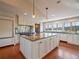 Open kitchen boasts custom cabinets, large island, and professional-grade appliances at 5939 Lone Peak Dr, Evergreen, CO 80439