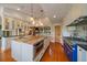 Spacious kitchen featuring an island with marble countertop and stainless steel appliances at 5939 Lone Peak Dr, Evergreen, CO 80439