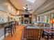 Cozy living room with fireplace, built-in shelving, and bar seating at 5939 Lone Peak Dr, Evergreen, CO 80439