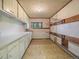Inside the rustic tack room featuring built-in storage and a vintage aesthetic at 5939 Lone Peak Dr, Evergreen, CO 80439