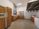Large tack room with lots of natural light, wooden beams, and plenty of storage at 5939 Lone Peak Dr, Evergreen, CO 80439