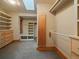 Organized walk-in closet with custom shelving, drawers, and a skylight at 5939 Lone Peak Dr, Evergreen, CO 80439