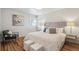 Cozy main bedroom with a comfortable bed, stylish decor, and ample natural light at 5008 Alcott St, Denver, CO 80221