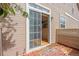 Inviting back patio with sliding glass door access to the home's interior at 4069 S Abilene Cir # E, Aurora, CO 80014