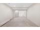 Spacious basement with exposed concrete floor and freshly painted walls at 4069 S Abilene Cir # E, Aurora, CO 80014