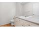 Bathroom featuring wooden floors, toilet, sink, and vanity with a large mirror at 4069 S Abilene Cir # E, Aurora, CO 80014
