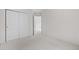 Neutral bedroom with light carpet, closet, and freshly painted walls at 4069 S Abilene Cir # E, Aurora, CO 80014