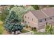 Charming exterior view of a two-story home with well-maintained landscaping, a private balcony and an attached garage at 4069 S Abilene Cir # E, Aurora, CO 80014