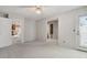 Bright open bedroom showing the carpeted floor, fan, with a door and an open doorway to a bathroom at 12622 E Warren Dr # E, Aurora, CO 80014