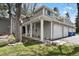 Charming home featuring a two-car garage, covered porch, and meticulously maintained lawn at 12622 E Warren Dr # E, Aurora, CO 80014