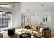 Bright living room boasts natural light, a cozy couch, and open access to other spaces at 12622 E Warren Dr # E, Aurora, CO 80014
