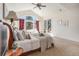 Main bedroom with vaulted ceiling, exterior deck access, and cozy decor at 2416 Fossil Trace Dr, Golden, CO 80401