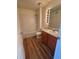Clean bathroom with tub/shower, wood vanity, and sleek lighting at 7414 E 28Th Ave # 4, Denver, CO 80238