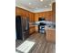 Well-lit kitchen with stainless steel appliances and light wood cabinets at 7414 E 28Th Ave # 4, Denver, CO 80238