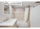 Basement bathroom features a tub, shower, and updated vanity at 1331 N Ogden St # 1, Denver, CO 80218