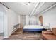 Finished basement bedroom with exposed brick and a comfortable sleeping area at 1331 N Ogden St # 1, Denver, CO 80218