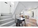 Basement apartment entry with stairs and small dining area at 1331 N Ogden St # 1, Denver, CO 80218