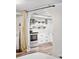 Modern white kitchen in a finished basement space at 1331 N Ogden St # 1, Denver, CO 80218
