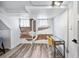 Basement office area with exposed brick and a workspace at 1331 N Ogden St # 1, Denver, CO 80218