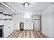 Bright kitchen with white cabinets, stainless steel appliances, and a farmhouse sink at 1331 N Ogden St # 1, Denver, CO 80218