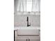 Modern kitchen sink with a chevron patterned backsplash at 1331 N Ogden St # 1, Denver, CO 80218