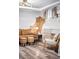 Basement living area with exposed brick wall and a cozy seating arrangement at 1331 N Ogden St # 1, Denver, CO 80218